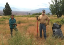 Wally (right), pulling weeds in Swall Meadows to maintain healthy native plant populations and enhance wildlife habitat.